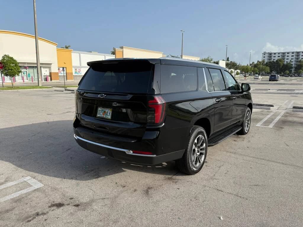Black Chevrolet Suburban waiting for a Miami International Airport pickup