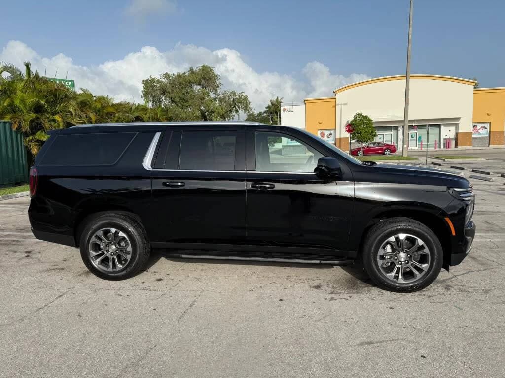 Side view of a black Chevrolet Suburban for Port Miami cruise transportation
